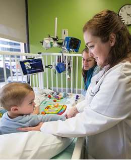 One-year-old Atlas Faucher was diagnosed with Pompe disease, a rare genetic disorder, when he was three months old. His mother, Genevieve, and Dr. Gabrielle Geddes discuss how Atlas is doing during an enzyme infusion treatment at Children's Hospital of Wisconsin